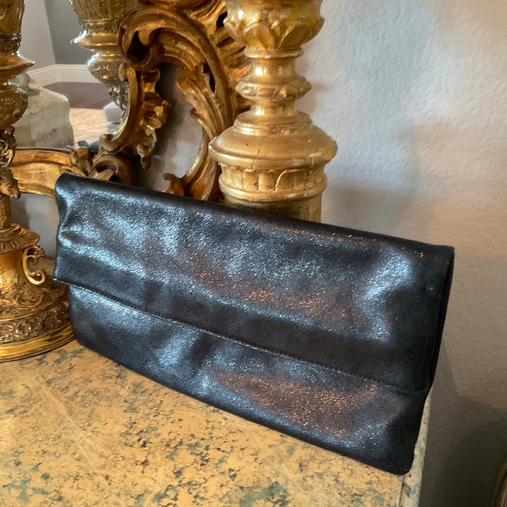 Glint women’s black metallic clutch with pale pink satin interior 100% leather